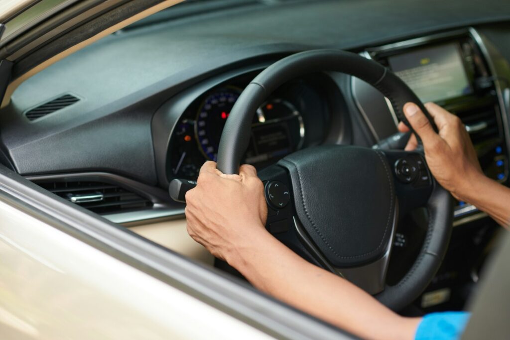 Driver Turning Steering Wheel